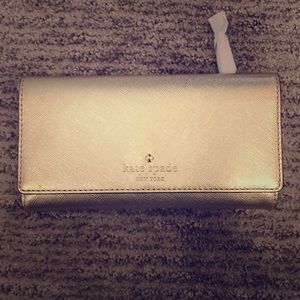 Kate spade gold wallet. Never used!!